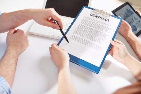 People reviewing contract